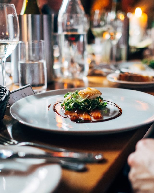 A FruBit partner plating a signature dish